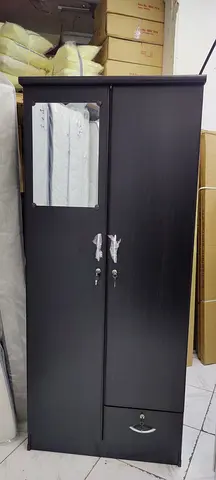 We are selling 2 door wood cabinet brand new