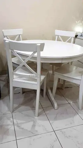 IKEA extendable dining table with 4 chairs is available