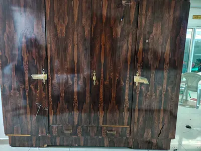 Solid wood armoire with intricate design