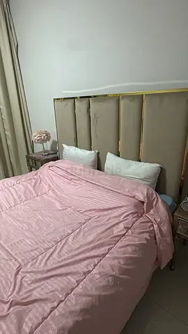 Cozy Pink Bed with Stylish Headboard