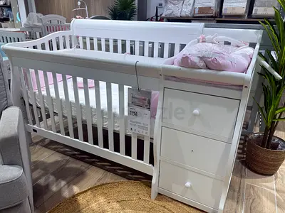Elegant White Crib with Storage Drawers