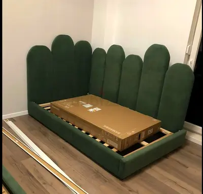 Cozy, soft daybed with scalloped luminous headboard