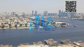 One-bedroom apartment with a living room, vacant, overlooking Ajman Creek, for sale in Orient Tower