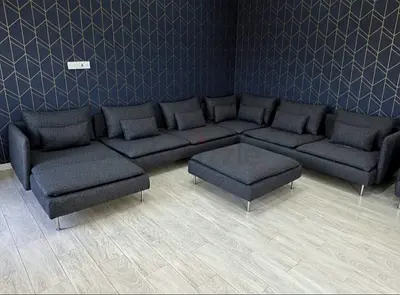 Luxury Corner Sofa Set in dark grey color. Minimal design with clean lines and strong base support.