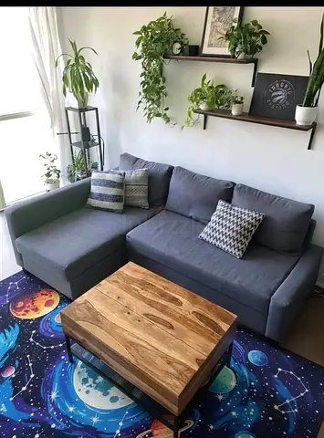 IKEA storage sofa bed — easily converts from a comfortable sofa into a cozy bed within seconds.