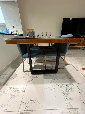 Stylish Wooden Dining Table with Elegant Base and West Elm Chairs