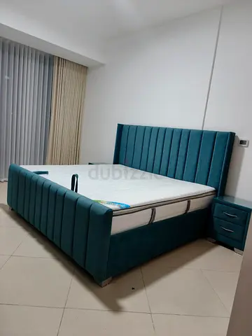 Stylish Blue Upholstered Bed with Nightstand