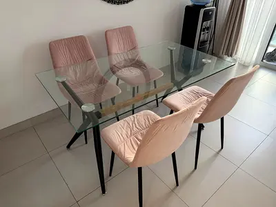 Glass Dining Table with Pink Chairs