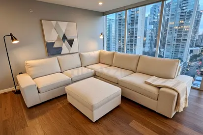 Contemporary L-Shaped Sofa – Wide armrests, clean stitching, and minimalist look to enhance any livi