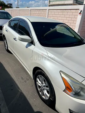 White Nissan Altima personal used in dubai