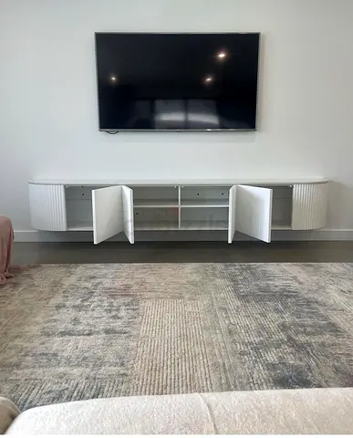 Minimalist Curved Media Console in Custom MDF with Seamless Wall Mount