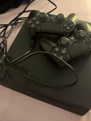 Sony PlayStation 4 Console with Two Controllers