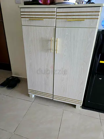 Stylish Storage Cabinet with Golden Accents