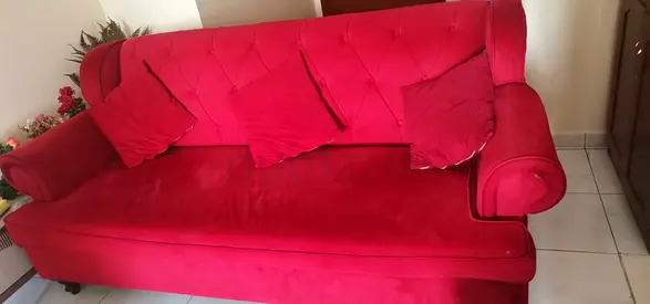 Red colored 3-seater sofa