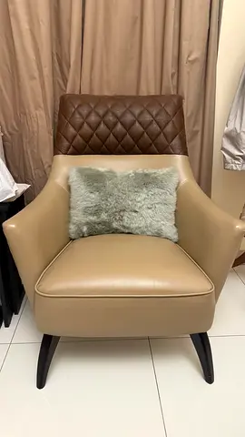 Two brown leather chairs
