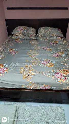 King-size wooden bed