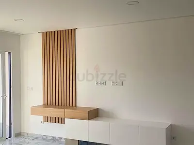 Contemporary TV Feature Wall with Integrated Floating Shelves