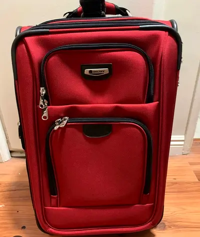 Delsey vintage Red Wheeled Luggage