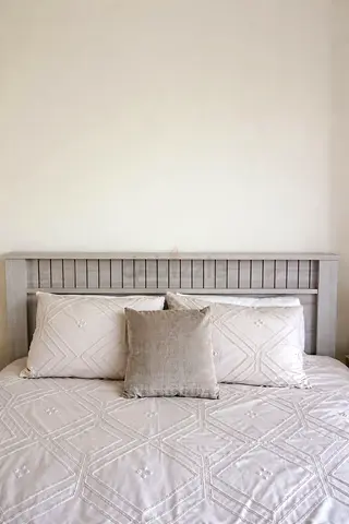 Stylish Grey Bed Frame with Plush Bedding