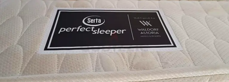 A spacious and comfortable King Size mattress (200x200 cm) available for sale with 2 side table
