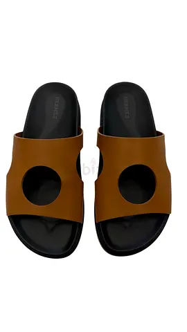 Hermès Edith Cut-out Leather Sandals in brown calfskin.