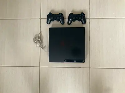 PlayStation 3 (Slim, 250 GB) + 2 PlayStation 3 DualShock Controllers