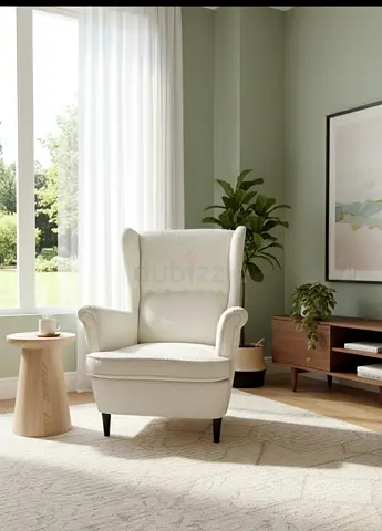 Modern Cozy Lounge Chair Minimalist style chair with neutral fabric and sleek black wooden legs. Com