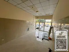 Commercial shop for rent in Al Rawda 2 area, near Sheikh Ammar Street, Dubai and Sharjah exit. Parki