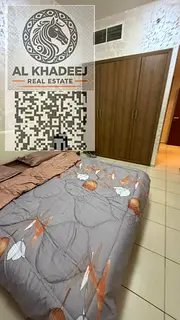 Two-bedroom apartment with a living room and balcony for sale in Ajman One Tower, with city and gard