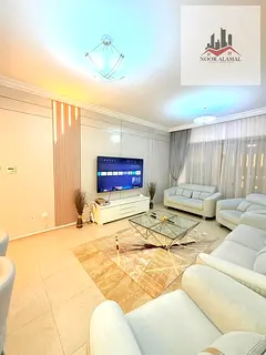 Sharjah, Al Taawun area: Two bedrooms, living room, new furnishings, kitchen, two bathrooms, and bal