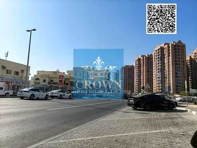 Urgent Sale: Premium Corner Commercial Building on Main – Al Nuaimia 1, Ajman