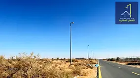 Industrial land for sale in Al Sajaa Industrial Area, freehold ownership.