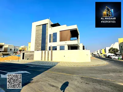 For sale: Two-story villa with a rooftop terrace and an indoor swimming pool, one of the most luxurious villas in Ajman, near Mohammed Bin Zayed Road.