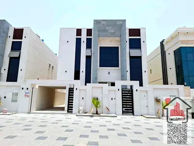 Two-storey villa for rent in Ajman, Al Helio 2 area Opposite Sheikh Mohammed bin Zayed Street Setback in front of the villa 5 master bedrooms, a living room, a hall And a maid's room Required 110 thou