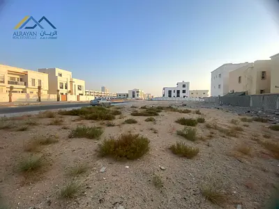 For sale, residential land \ in the most upscale area of ​​Ajman \ Al Alia area \ on an asphalt street \ very large setback in front of the villa *