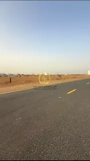Residential land for sale in Rawdat Al-Qurt area, Al-Ruwaida suburb. Corner plot on two streets, 24