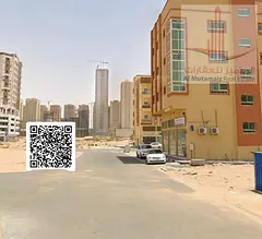 Residential/commercial land for sale on a main street in Al-Aliya area – prime location, directly 