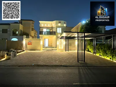 Luxury villa for sale in Al Muwaihat, Ajman, with a swimming pool, price includes electricity, water, and air conditioning.