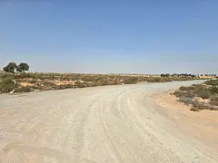 For sale, residential land, townhouse, Umm Al Quwain, on Sheikh Mohammed bin Zayed Road, next to Umm