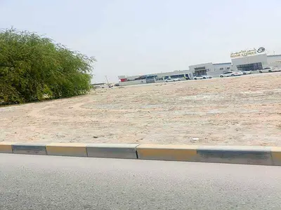 Land for sale in Al Sajaa Al Hanoo Al Qadeem area, corner location, prime location