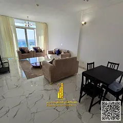 With an open view, a fully furnished two-bedroom apartment with a living room for monthly rent in Aj