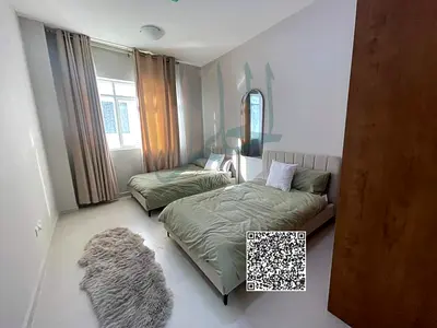 Apartment for sale with free ownership, down payment, and 7 years installment in Al-Amirah village, Ajman, overlooking a garden with a spacious area a