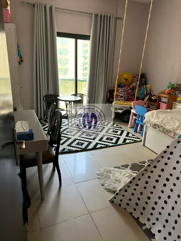 A beautiful and spacious two-bedroom apartment with a living room and two bathrooms in Al Rashidiya Towers is for sale.