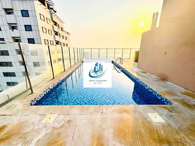 2 bhk very specious with wardrobe closed hall balcony gym pool car parking free just 55k Al nadha Shara near to sehra mall & near to nesto