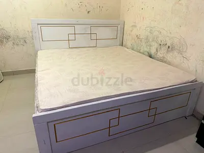 White Bed Frame with Gold Accents