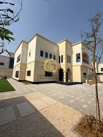 For sale: a new villa in Sharjah, Al Houshi area - Arab ownership. It features a modern and elegant design and consists of 5 master bedrooms with ward