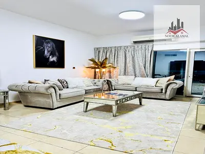 Sharjah Al Khan Furnished apartment with hotel furnishings, three rooms, a living room, a kitchen, three bathrooms, and a balcony with an open view