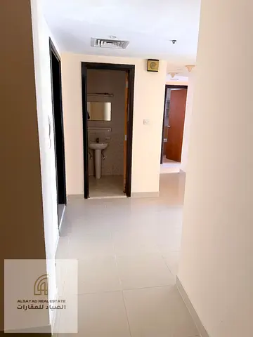 "Family apartment in Al Khan – 2 bedrooms and a living room + parking – prime location and excellent price."