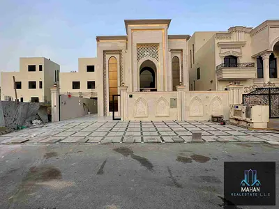 Classic villa for sale in Al Helio 2* Opposite Al Yasmeen Park Directly from the owner Near Sheikh Mohammed bin Zayed Road Land area / 3,350 square feet The villa consists of 5 master bedrooms with bu