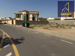 For sale: Residential corner plot on a street and alley in Al Quoz area, Wasit suburb, Sharjah Emira